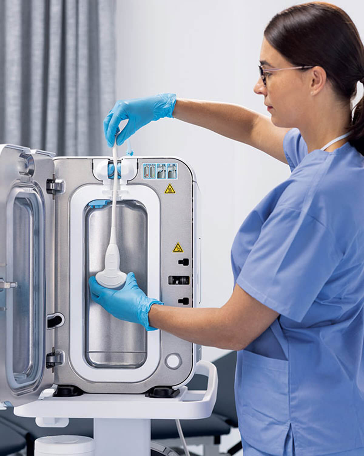 a nurse setting up trophon device